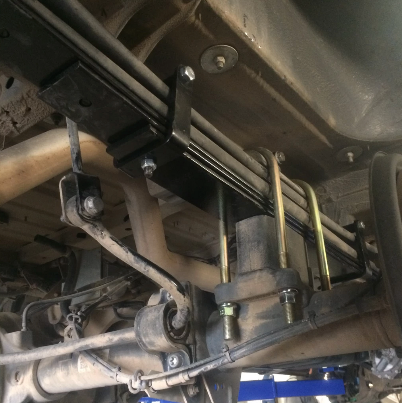 Installed Van Compass Mini Leaf Spring Pack underneath factory 2 leaf pack