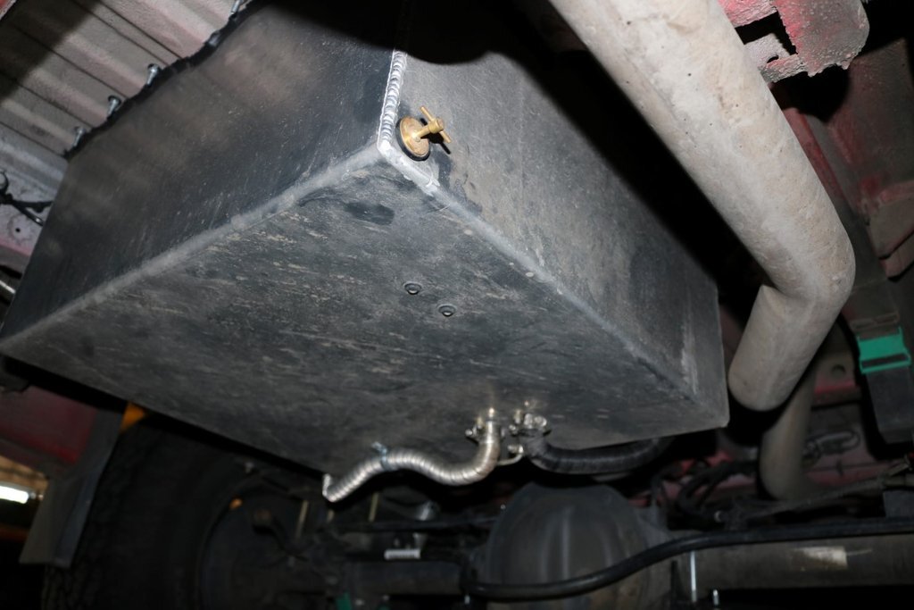 Van Compass Rear Storage Trunk viewed from underneath the van. Installed in previous spare tire location.